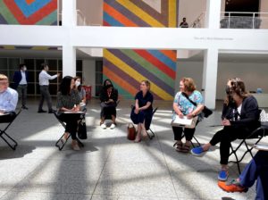 A group of people sitting in chairs

Description automatically generated with medium confidence